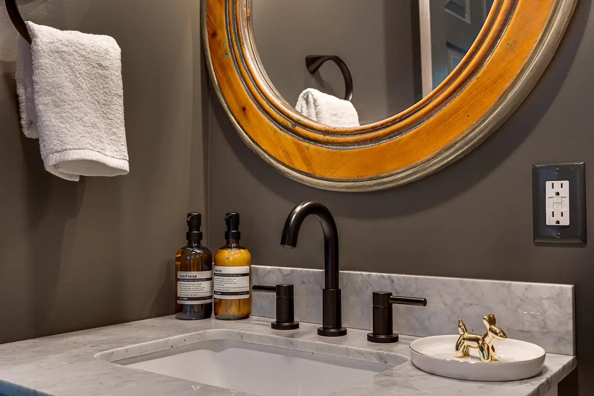 Enhance your stay with our elegant half bath, thoughtfully designed for effortless convenience and stylish comfort.